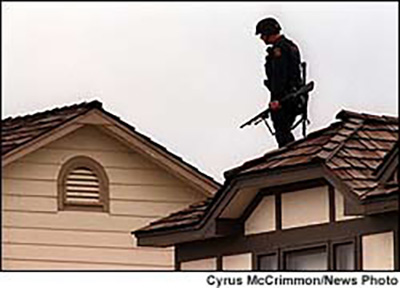 Columbine SWAT team secure the roof of nearby house Columbine SWAT team secure the roof of nearby house