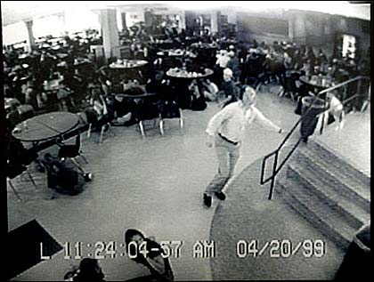 Coach Dave Sanders runs through Columbine's cafeteria