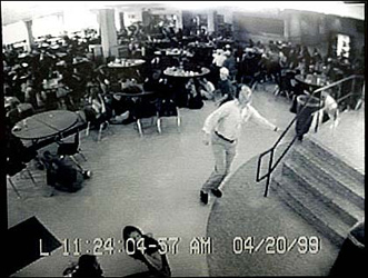 Dave Sanders runs through Columbine's cafeteria during the shootings