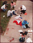 Blood stains the driveway at the triage station