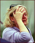 A mother waits anxiously for news